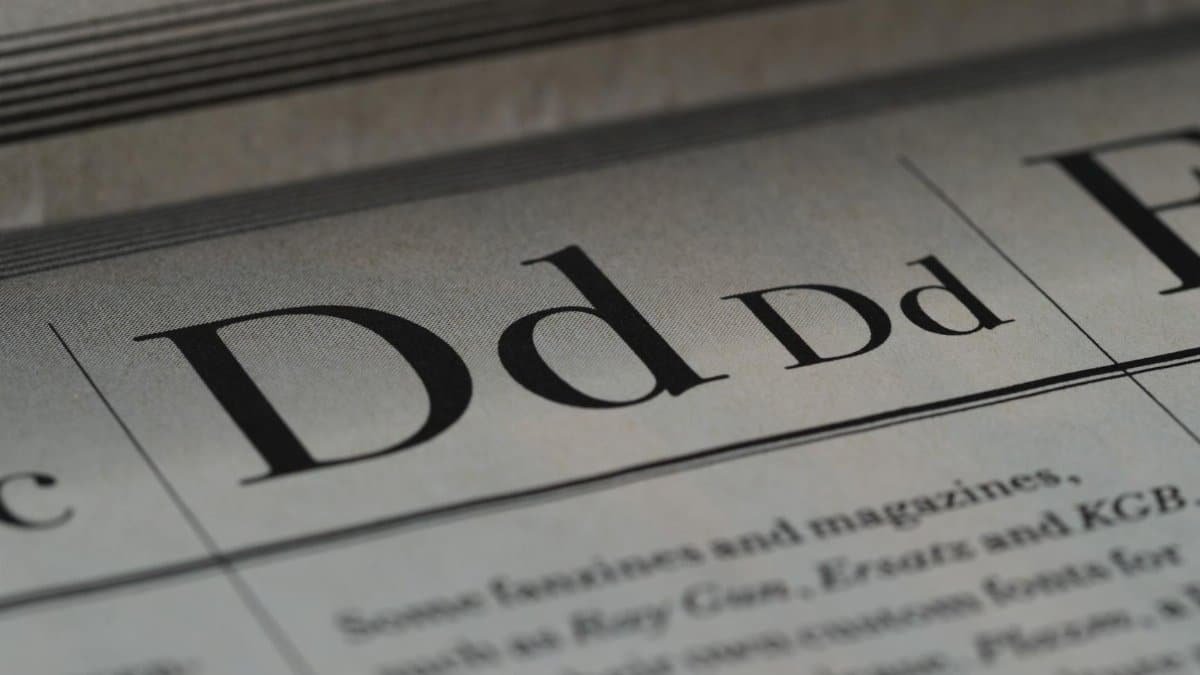 Detailed close-up of a newspaper showing typography and lettering design.