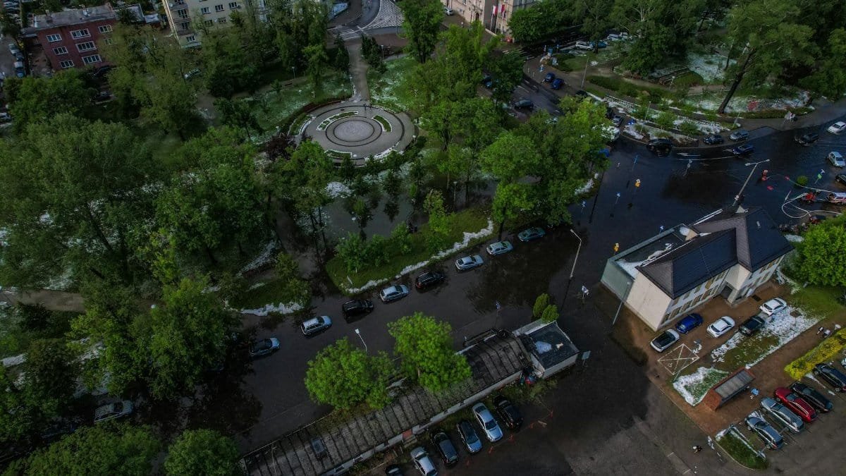 Aerial shot of a flooded city park and surrounding streets after a storm.