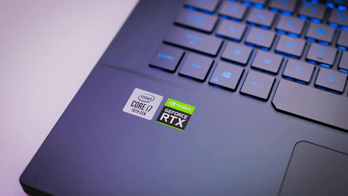 Laptop keyboard with Intel Core i7 and NVIDIA GeForce RTX stickers, symbolizing high-performance computing power.