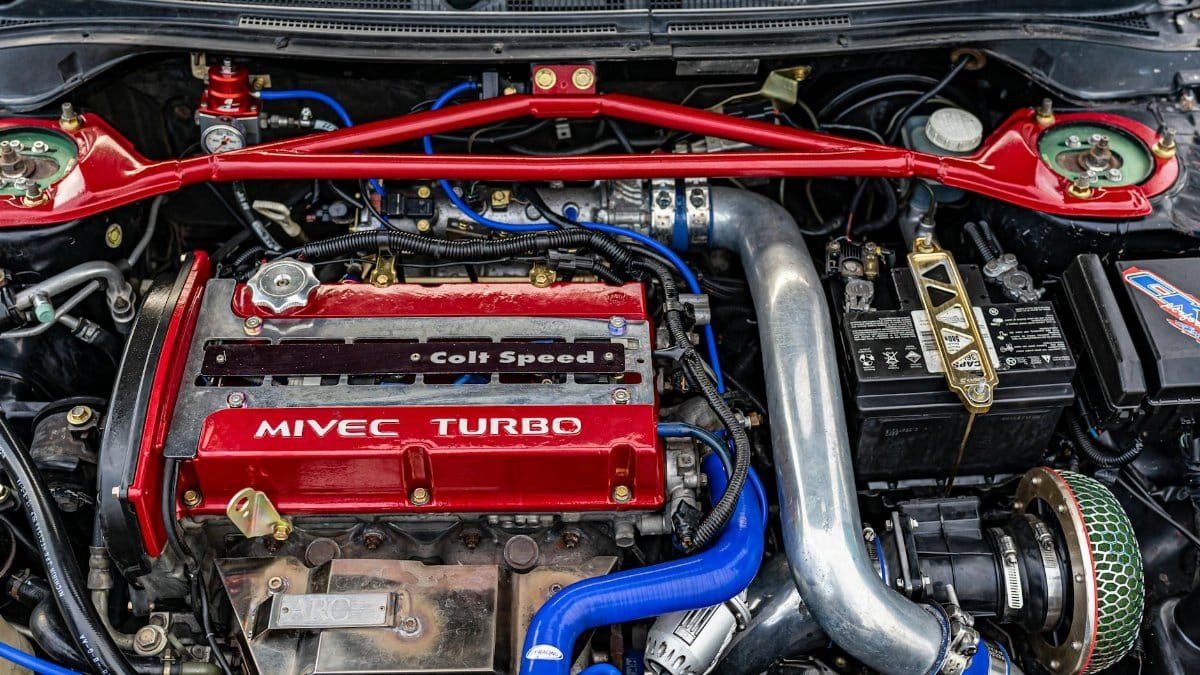 Close-up of a high-performance MIVEC turbo car engine showcasing technology and engineering.