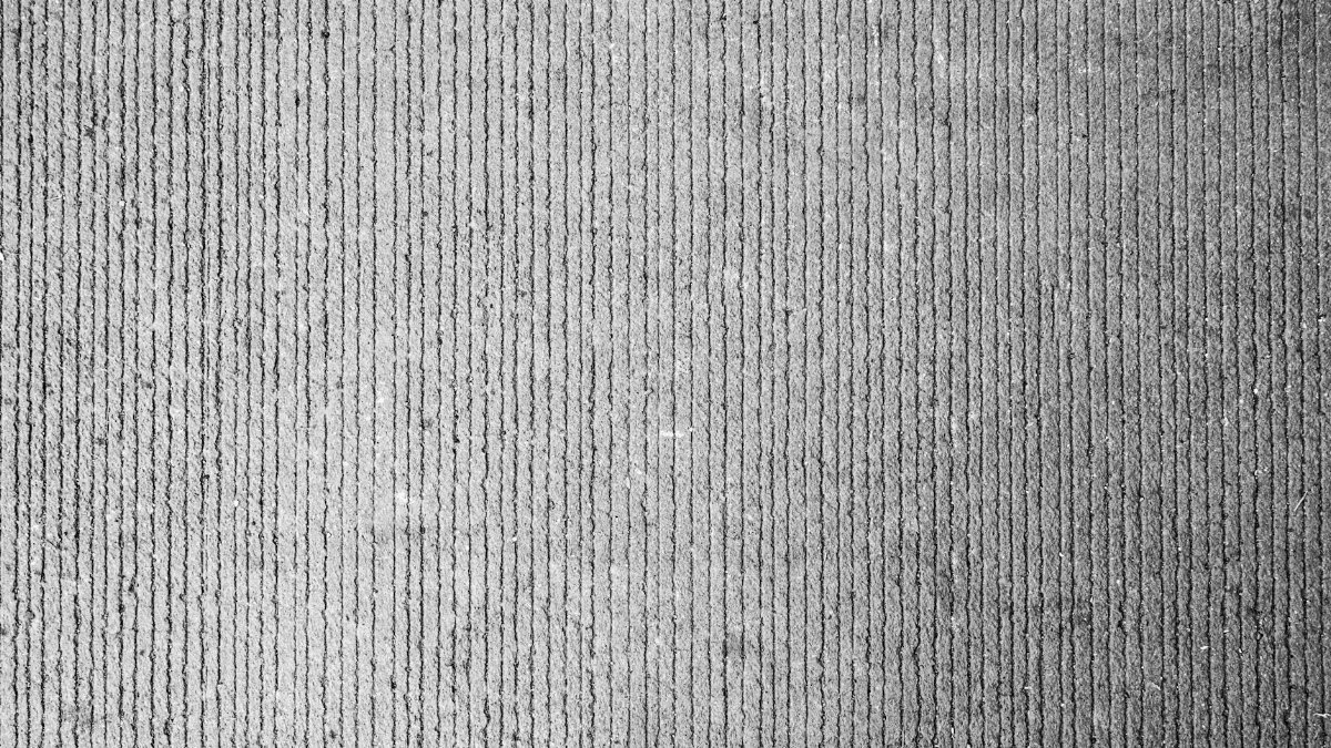 A detailed close-up of a weathered concrete wall texture with vertical lines.