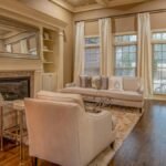 Contemporary living room featuring cozy furniture and a stylish fireplace.