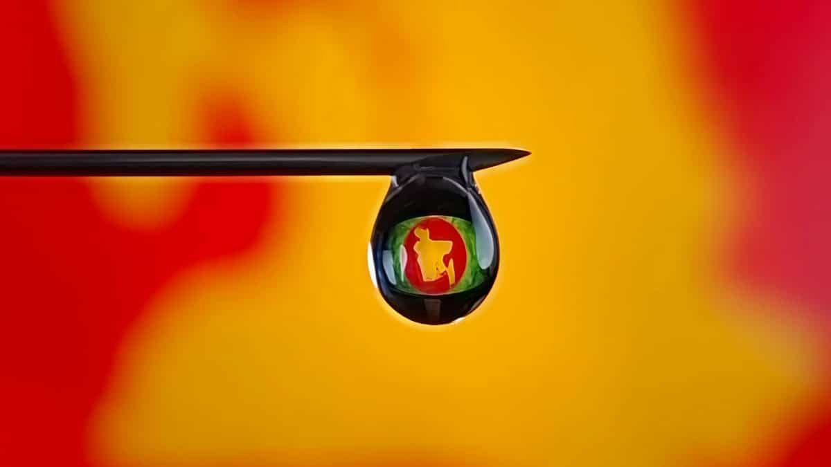 Abstract macro photography featuring a colorful reflection within a water droplet on a needle.