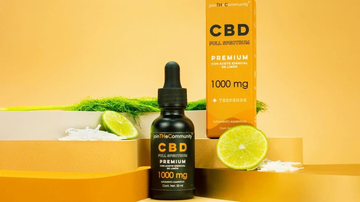 Premium CBD full spectrum serum with lime essential oil displayed on a vibrant yellow background.
