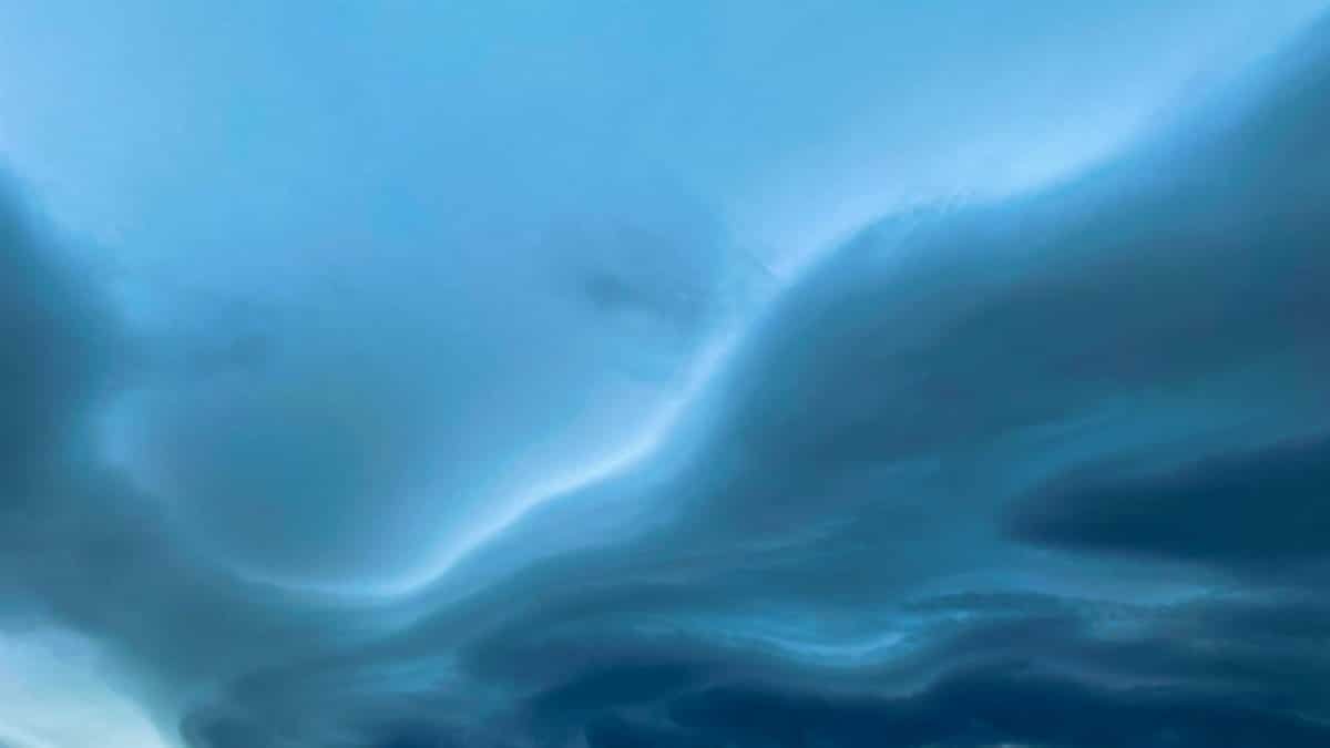 A captivating image of a stormy sky with wavy cloud formations, showcasing nature's dramatic and moody atmosphere.