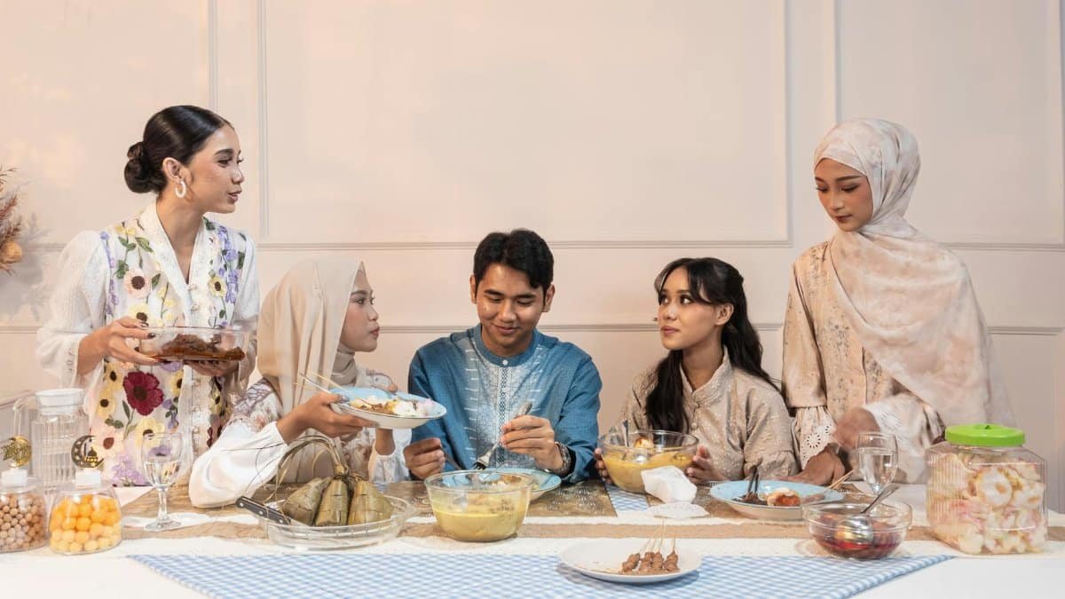 Indonesian family enjoying a traditional meal during Ramadan in Jakarta.