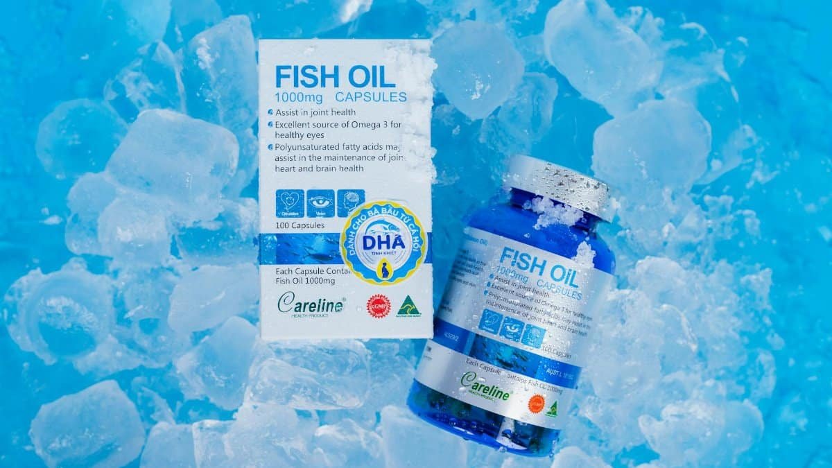 Fish oil capsules and packaging on ice, highlighting Omega 3 benefits for health.