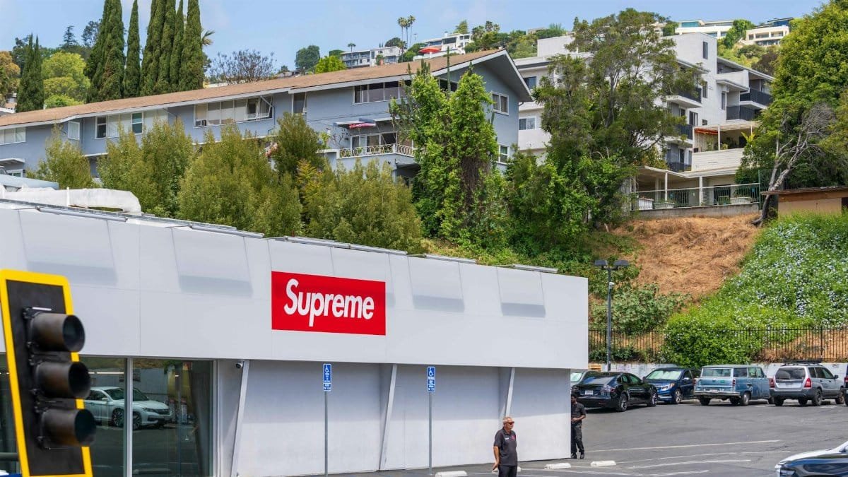 Exterior view of Supreme store in West Hollywood, capturing scenic hillside and urban fashion ambiance.