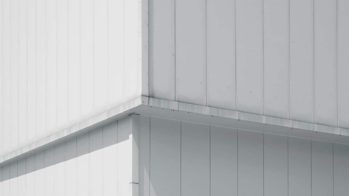 A minimalist capture of a building's geometric corner with subtle shadows.