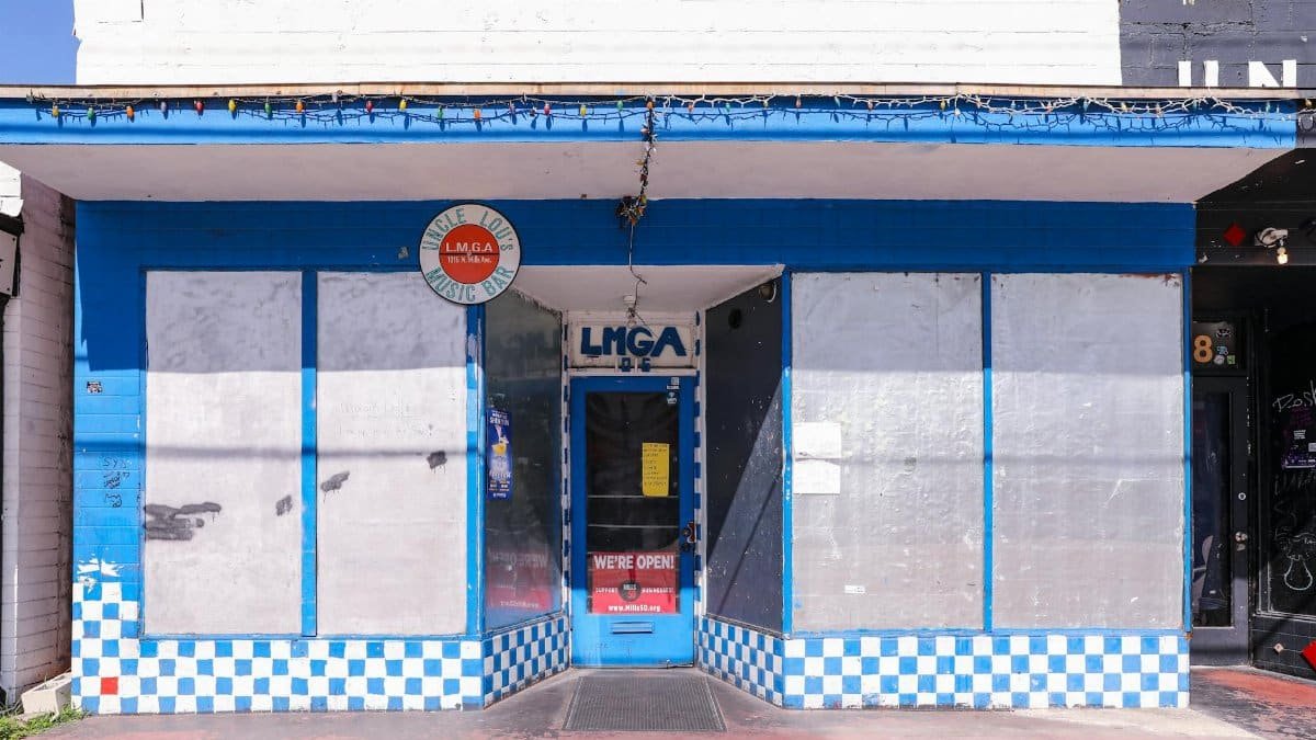 Front view of Uncle Lou's Music Bar, Orlando - vibrant blue exterior with signage.