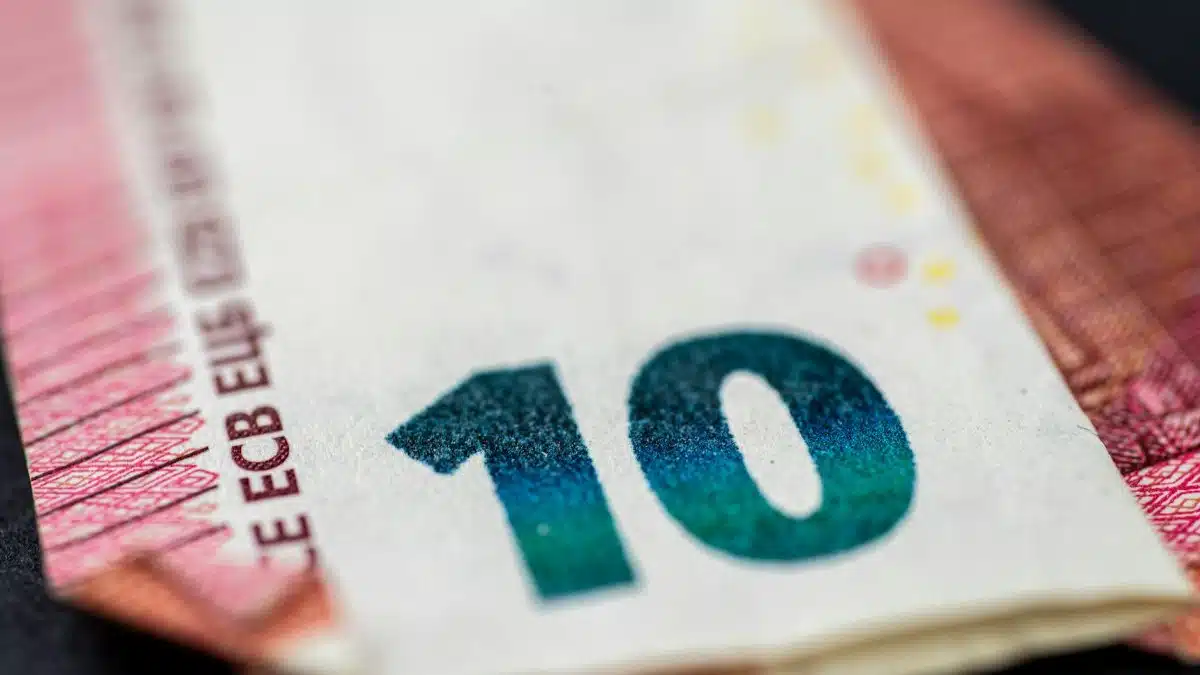 Detailed close-up of a ten euro banknote highlighting currency design and texture.
