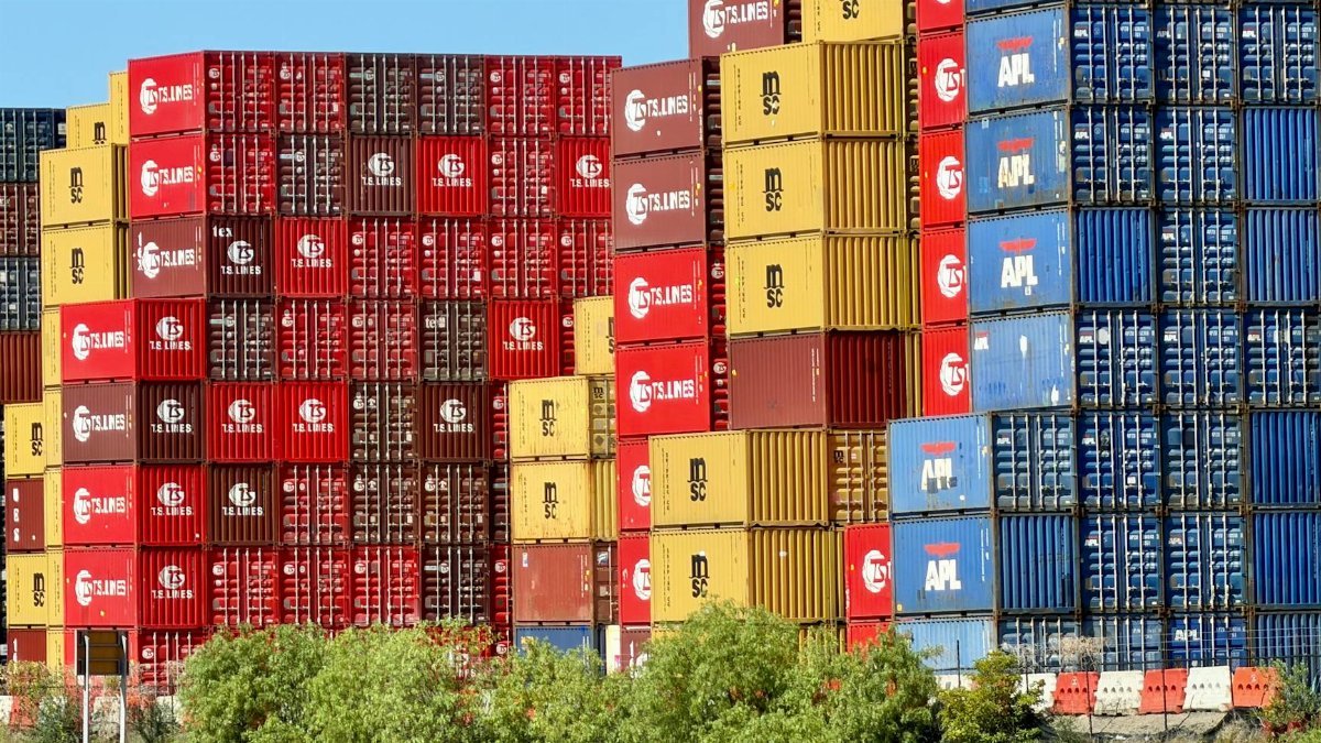 Vibrant shipping containers stacked at West Melbourne port, symbolizing Australian global trade.