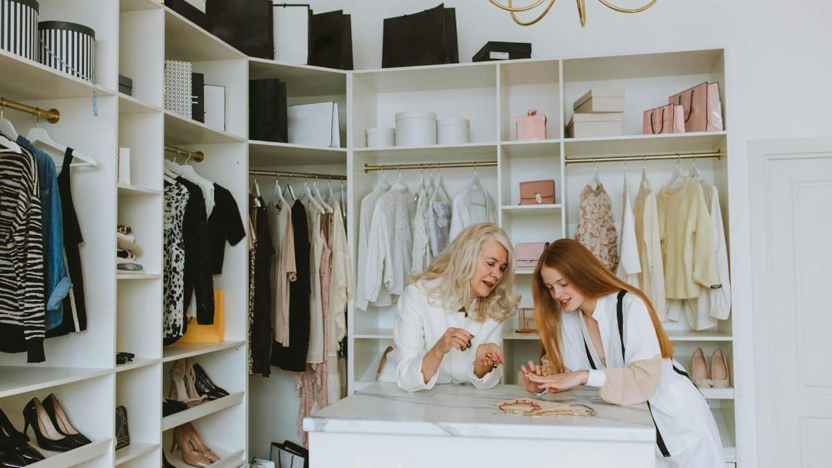 Two women enjoying a luxurious wardrobe setting, showcasing elegance and style.