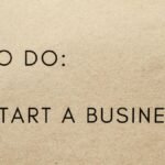 A close-up shot of a to-do list with 'Start a Business' written on it.