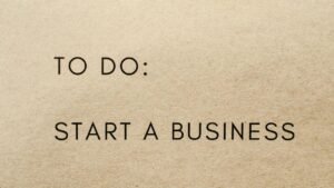 A close-up shot of a to-do list with 'Start a Business' written on it.