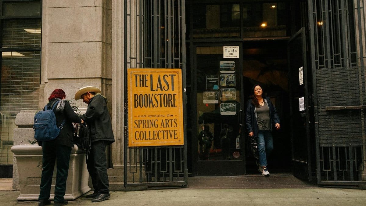 People outside The Last Bookstore in Los Angeles, capturing urban life.