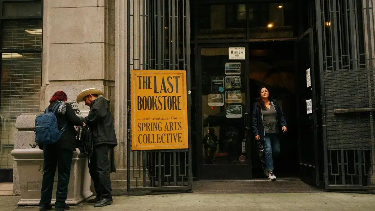 People outside The Last Bookstore in Los Angeles, capturing urban life.