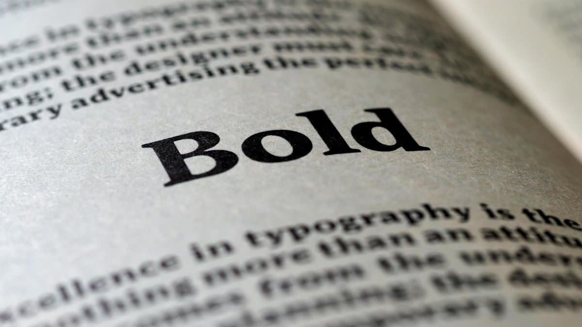 Focused image of the word 'Bold' in typography on a book page.