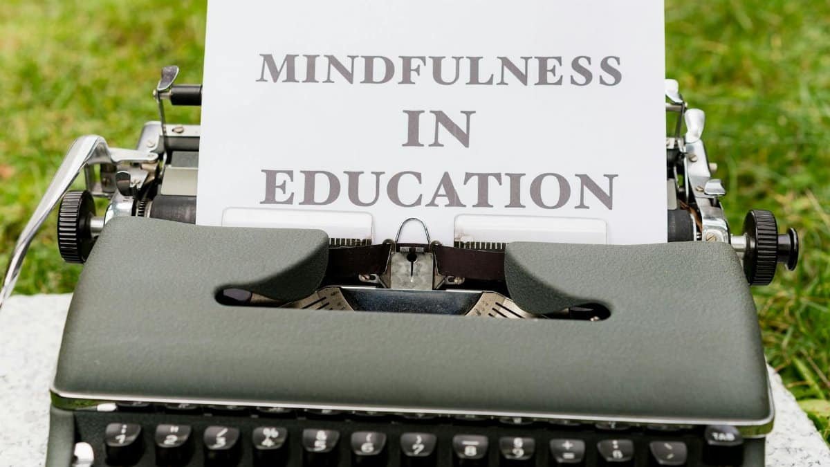 A vintage typewriter showcasing 'Mindfulness in Education' concept outdoors.