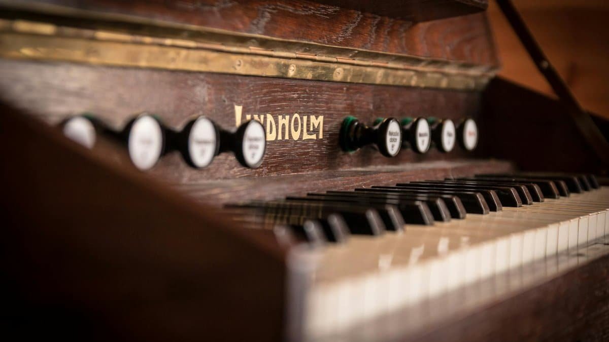 Close-up of vintage Lindholm piano keys capturing the essence of classic musical instruments.