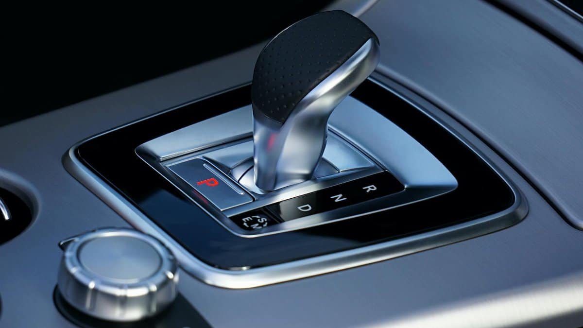 Detailed view of a sleek automatic gear shift in a luxury vehicle, emphasizing modern design.