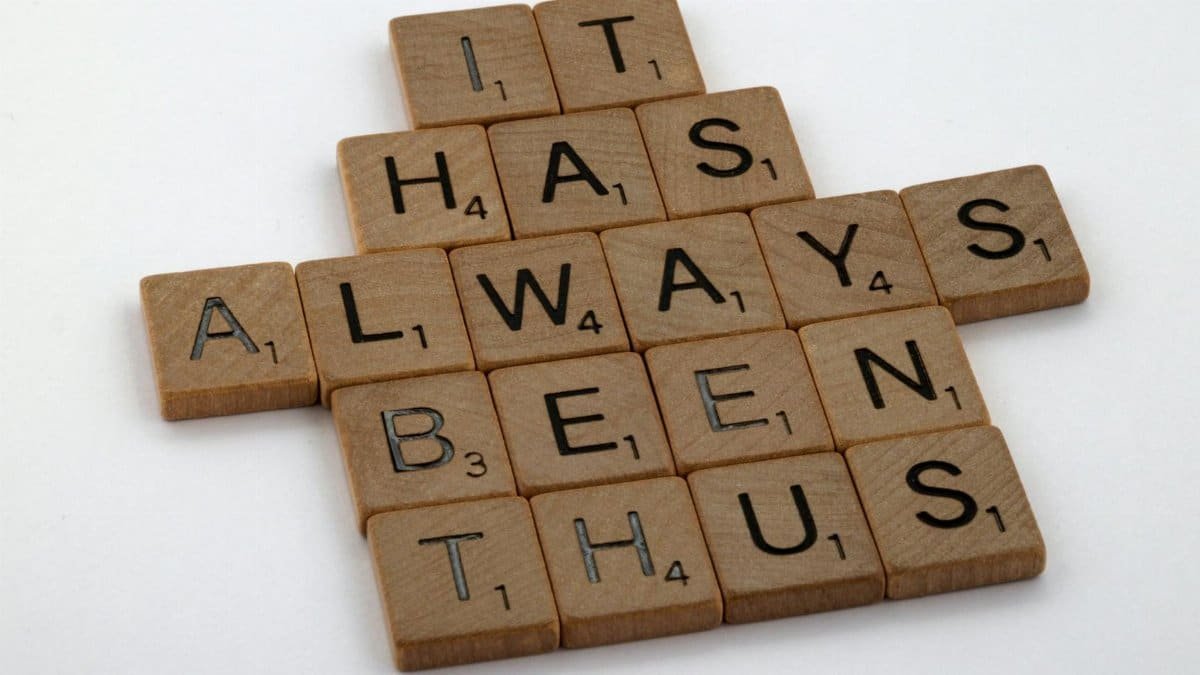 Wooden Scrabble tiles spelling the phrase 'It Has Always Been Thus' on a white background.
