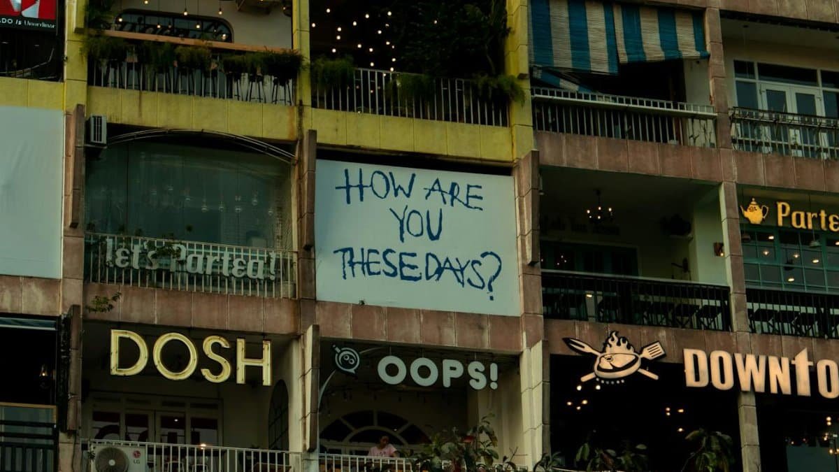 A colorful city building featuring neon signs and text displays, capturing urban vibrancy.