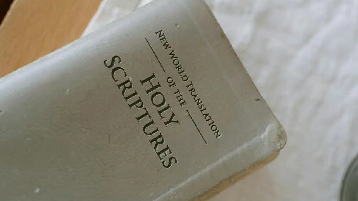 A close-up photo of the New World Translation of the Holy Scriptures on a table.