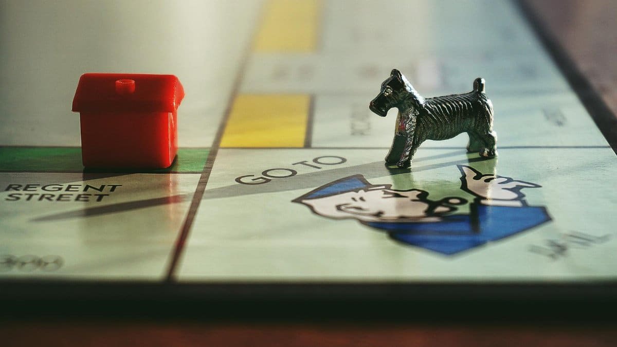 Detailed view of a Monopoly board with tokens on Regent Street.