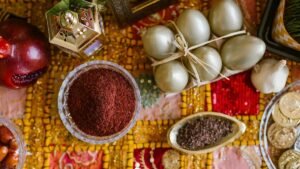 A vibrant Haft Seen table setting celebrating Persian New Year with symbolic items like eggs and garlic.