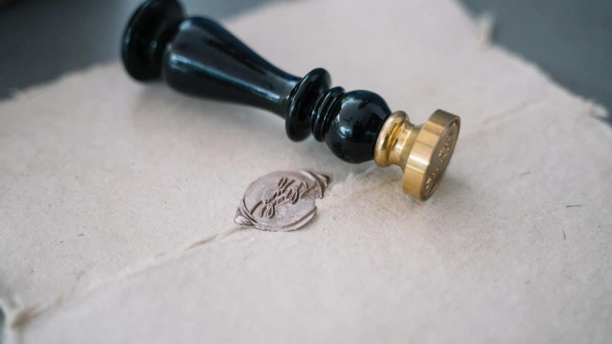 Close-up of vintage sealing wax and stamp on an old-fashioned envelope.