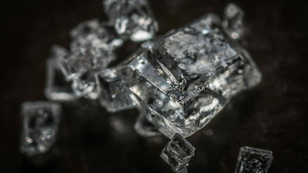 Macro shot of clear crystal cubes showcasing intricate details and textures.