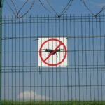 A 'No Drones' sign on a barbed wire fence in Morawica, Poland.