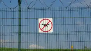 A 'No Drones' sign on a barbed wire fence in Morawica, Poland.