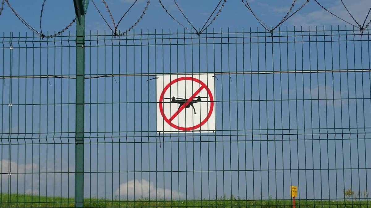 A 'No Drones' sign on a barbed wire fence in Morawica, Poland.