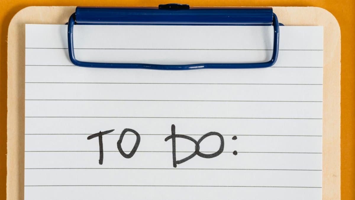 Clean and simple image of a to-do list on a clipboard with lined paper.