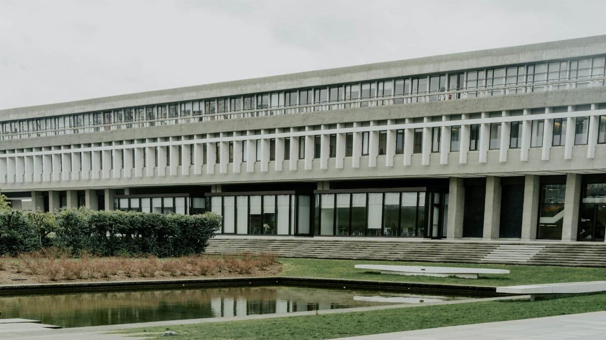 View of Simon Fraser University's Brutalist architecture with a reflecting pond in Burnaby, Canada.