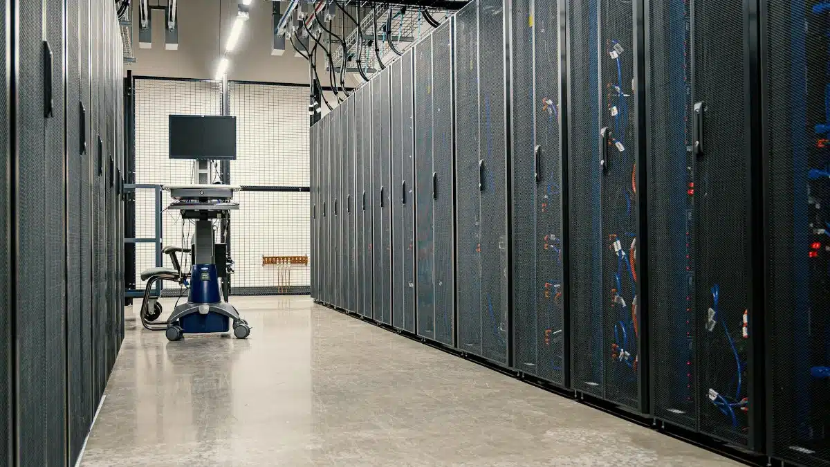 Modern data center corridor with server racks and computer equipment. Ideal for technology and IT concepts.