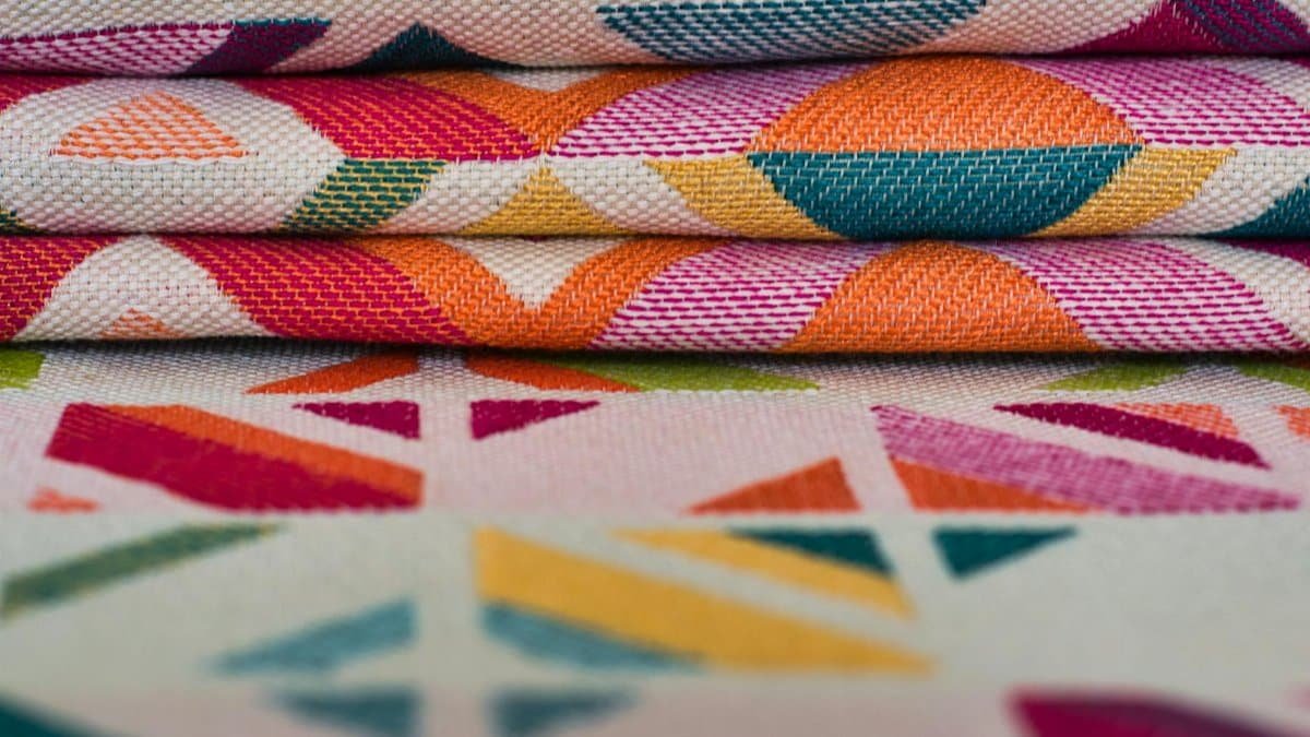 Brightly colored textiles with geometric patterns, ideal for creative projects or vibrant decor.