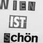 Creative typography art featuring the phrase 'Wien ist schön!' in black and white.