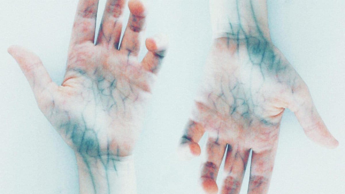 Creative depiction of vibrant human hands with detailed veins in a surreal style.