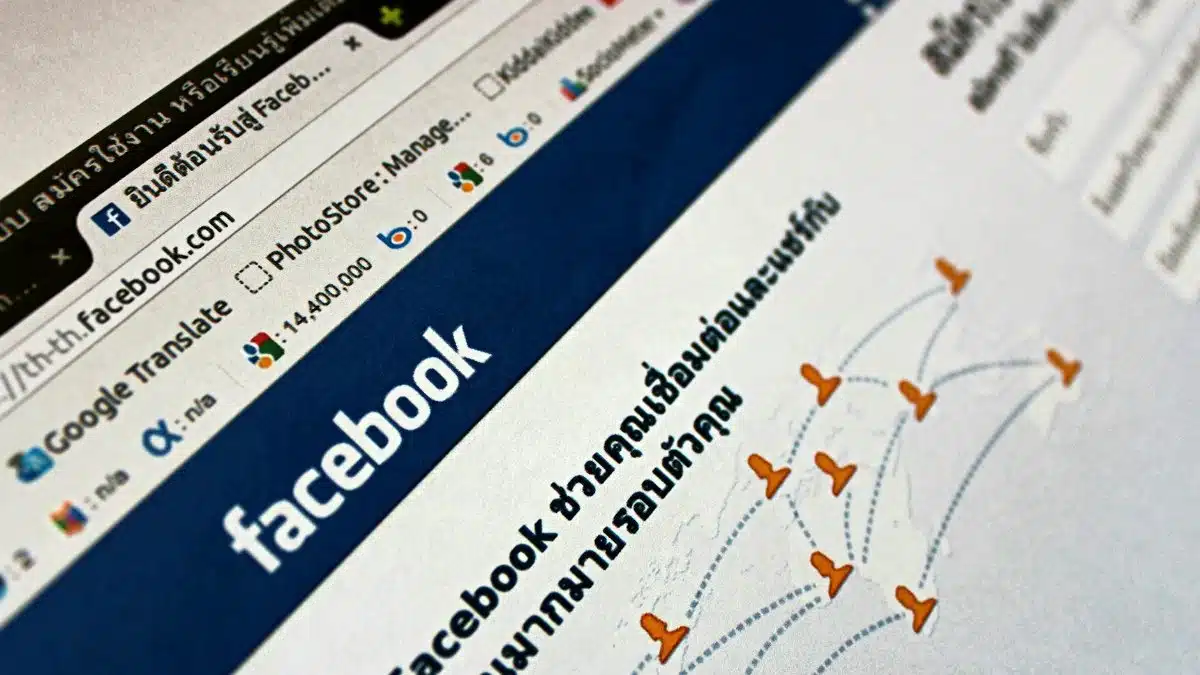 Close-up view of a Facebook webpage displayed on a browser with social media icons.