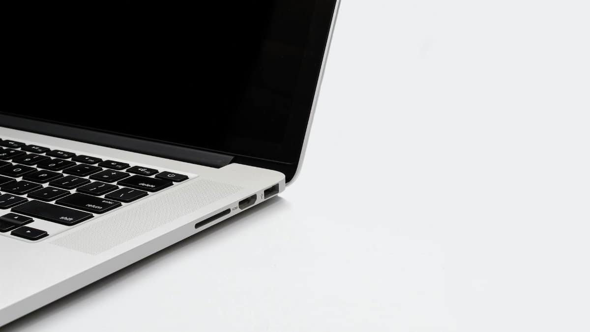Closeup of a sleek laptop keyboard and screen on a white background. Perfect for tech-related content.