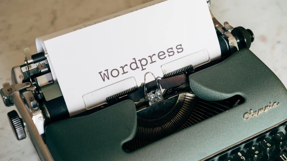 Close-up of a vintage typewriter with paper labeled WordPress.