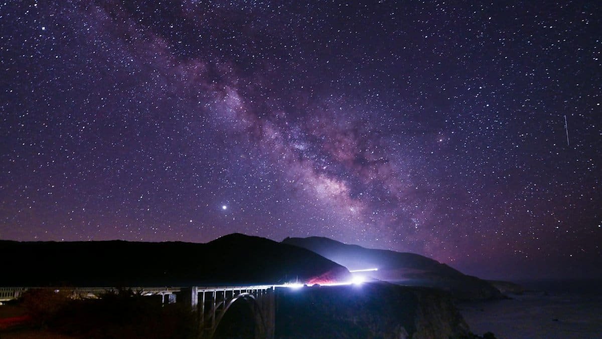 Night sky showcasing the Milky Way above Bixby Creek Bridge in Monterey, California.