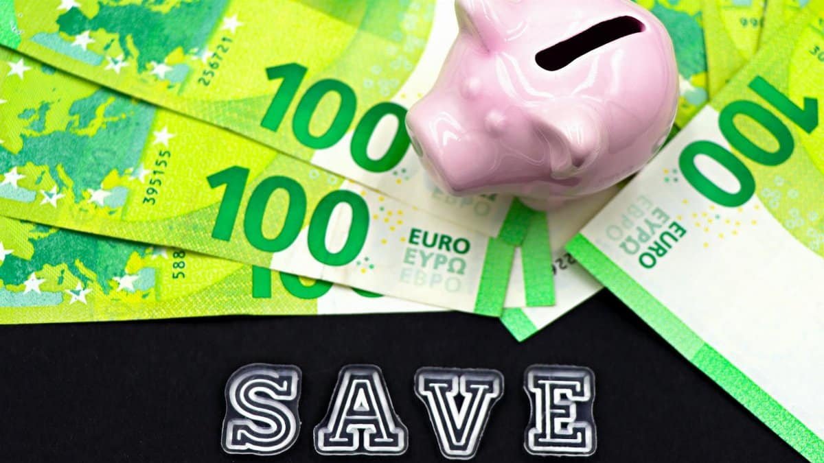 A piggy bank on euro bills with 'save' text highlights money saving concepts.