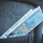 A folded map in a car seat pocket, perfect for planning a road trip.