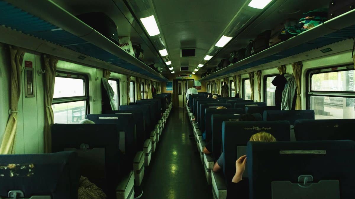 Passengers aboard a commuter train in Mar del Plata, Argentina, showcasing a typical travel scene.