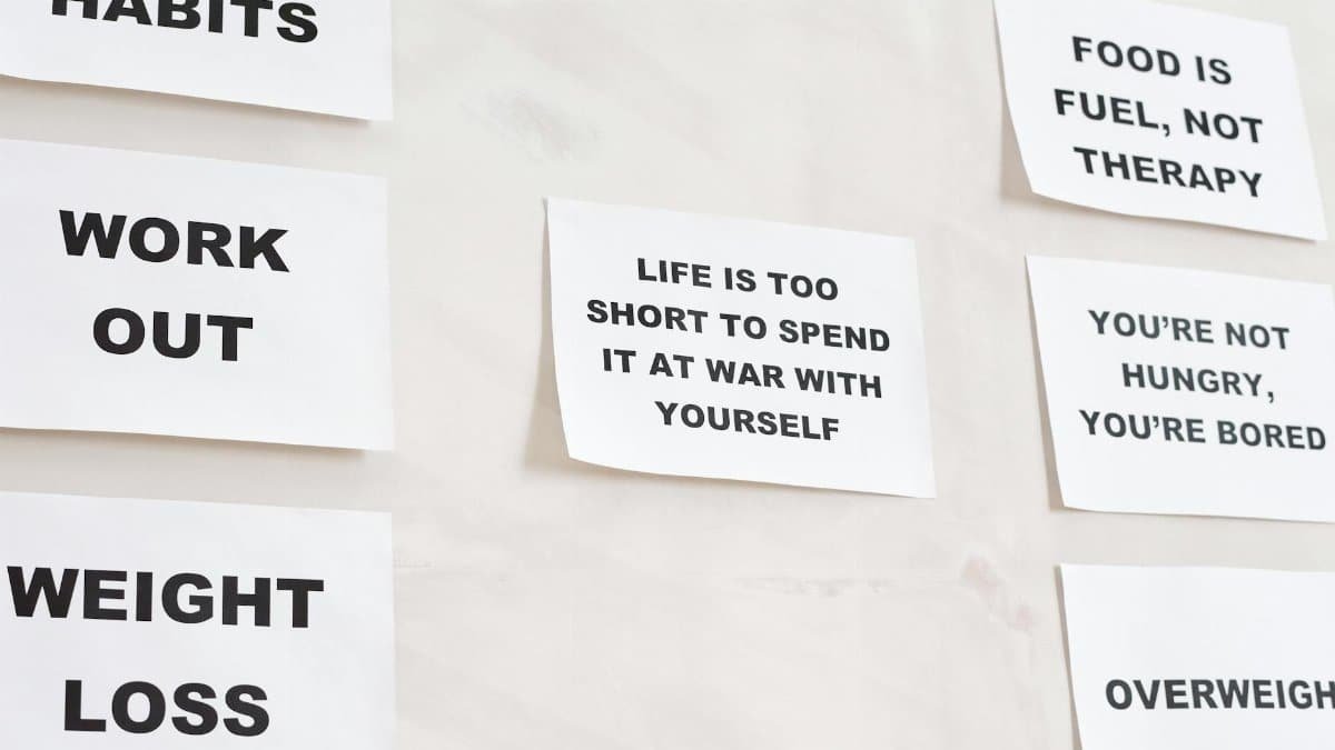 Motivational quotes on white paper promoting healthy habits and lifestyle changes.