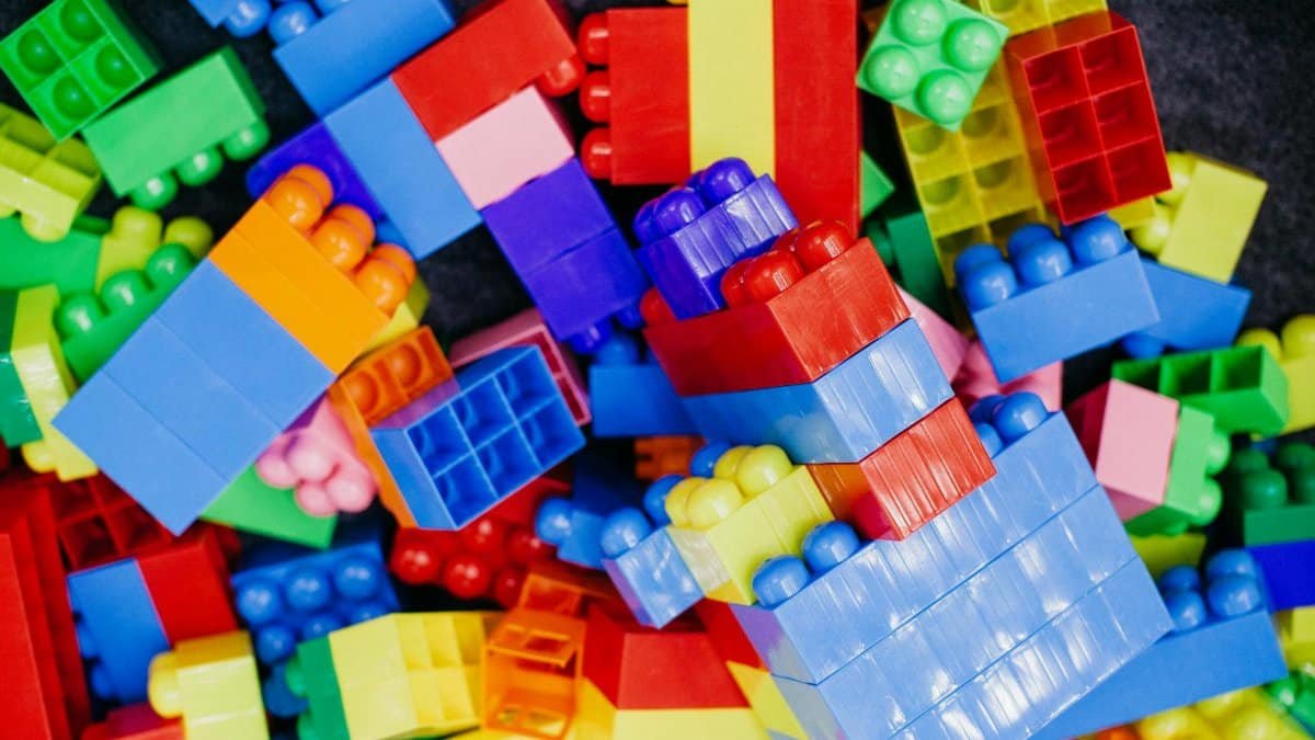 Brightly colored plastic building blocks arranged in a playful pattern, perfect for children's activities.